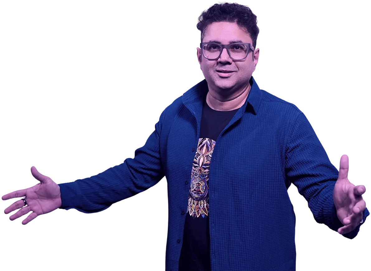 Sandeep Ranade, arms open on stage